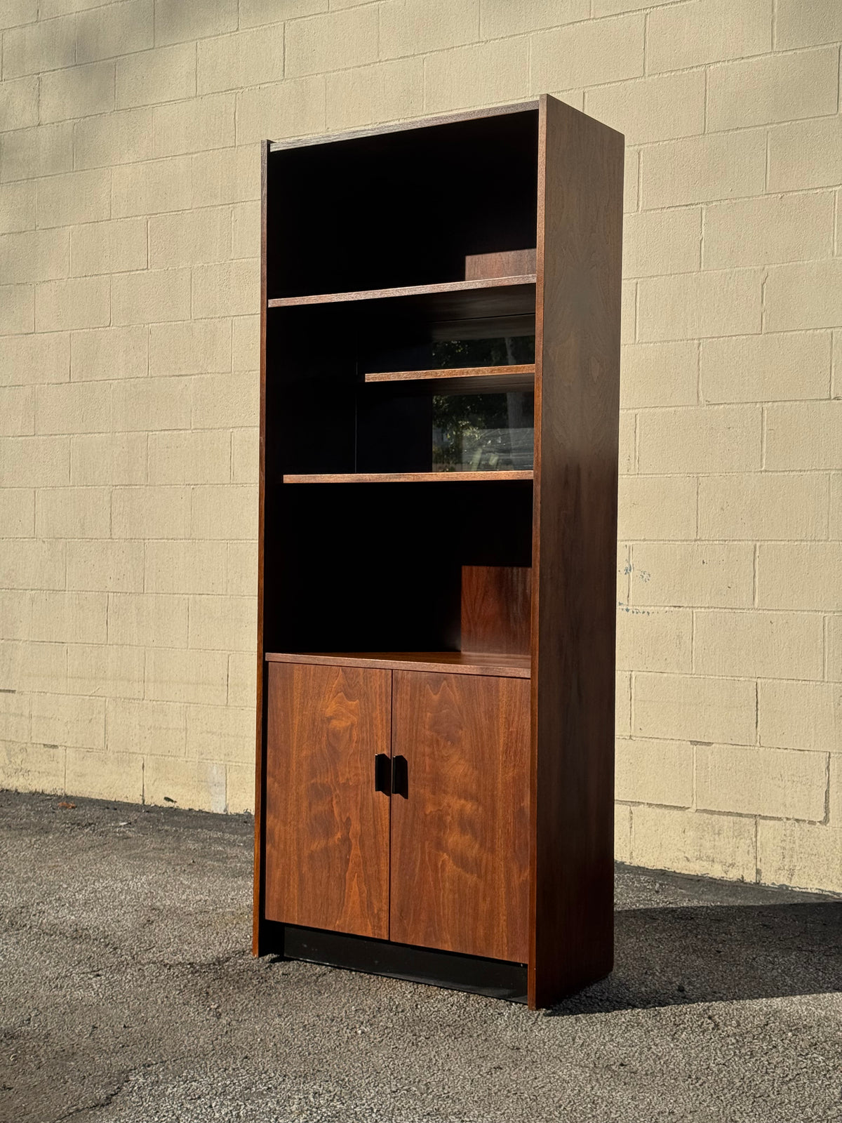 Midcentury Walnut Bookcase — Staggered Shelving & Cabinet Base