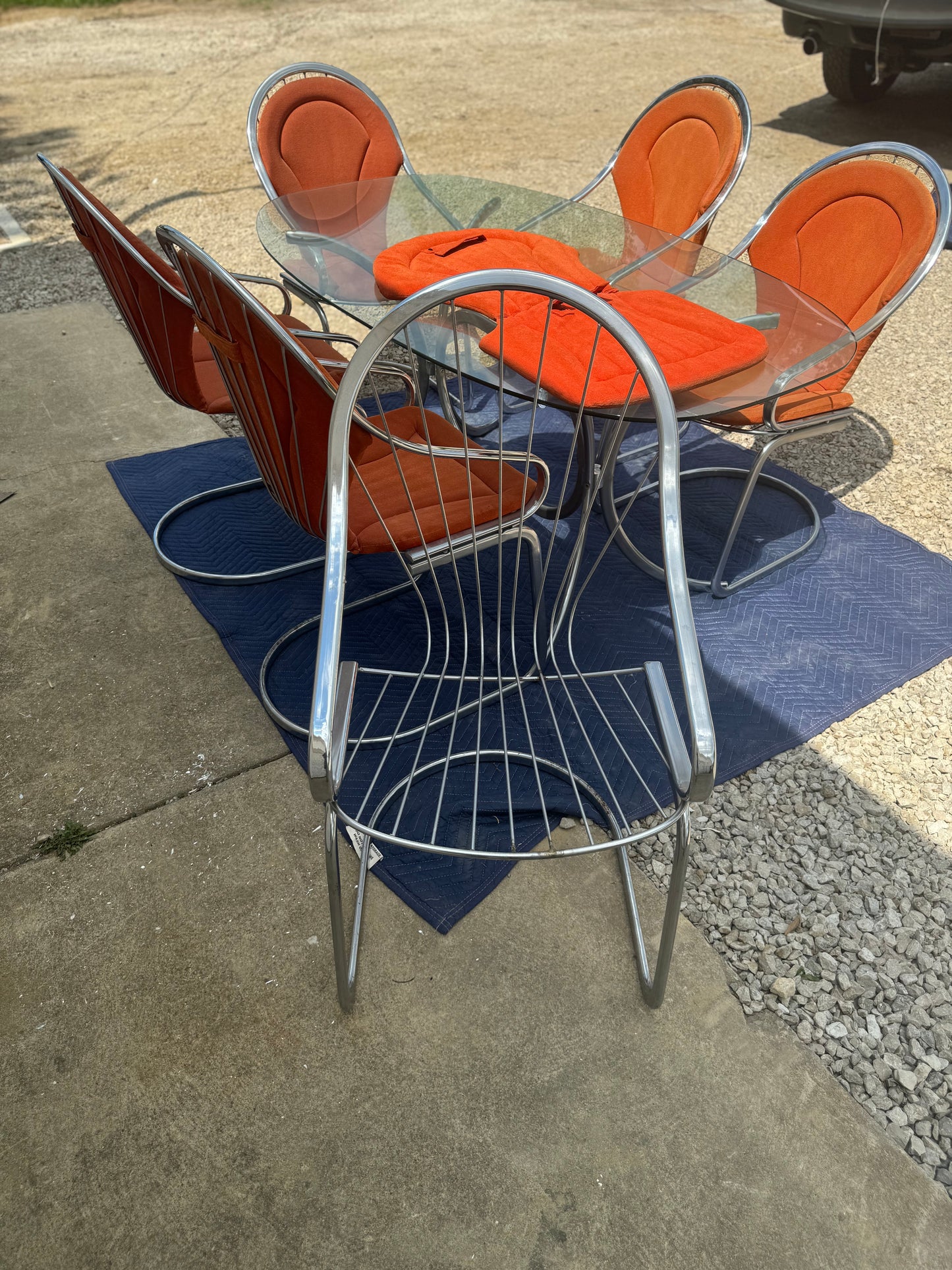 Midcentury Cantilever Dining Set - Chrome Chairs with Retro Orange Cushions and Chrome Table with Solid One-Piece Glass Top
