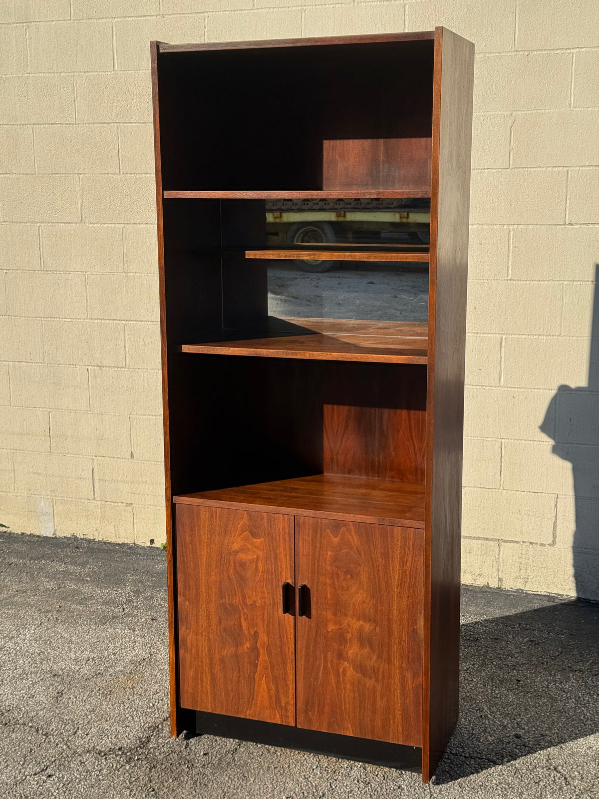 Midcentury Walnut Bookcase — Staggered Shelving & Cabinet Base