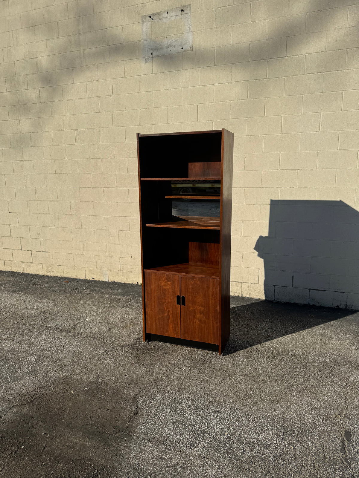 Midcentury Walnut Bookcase — Staggered Shelving & Cabinet Base
